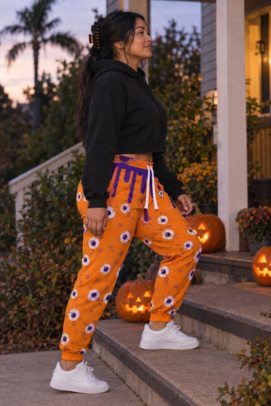 Halloween Pumpkin Orange Slime Drip Women's Joggers on a model, second view