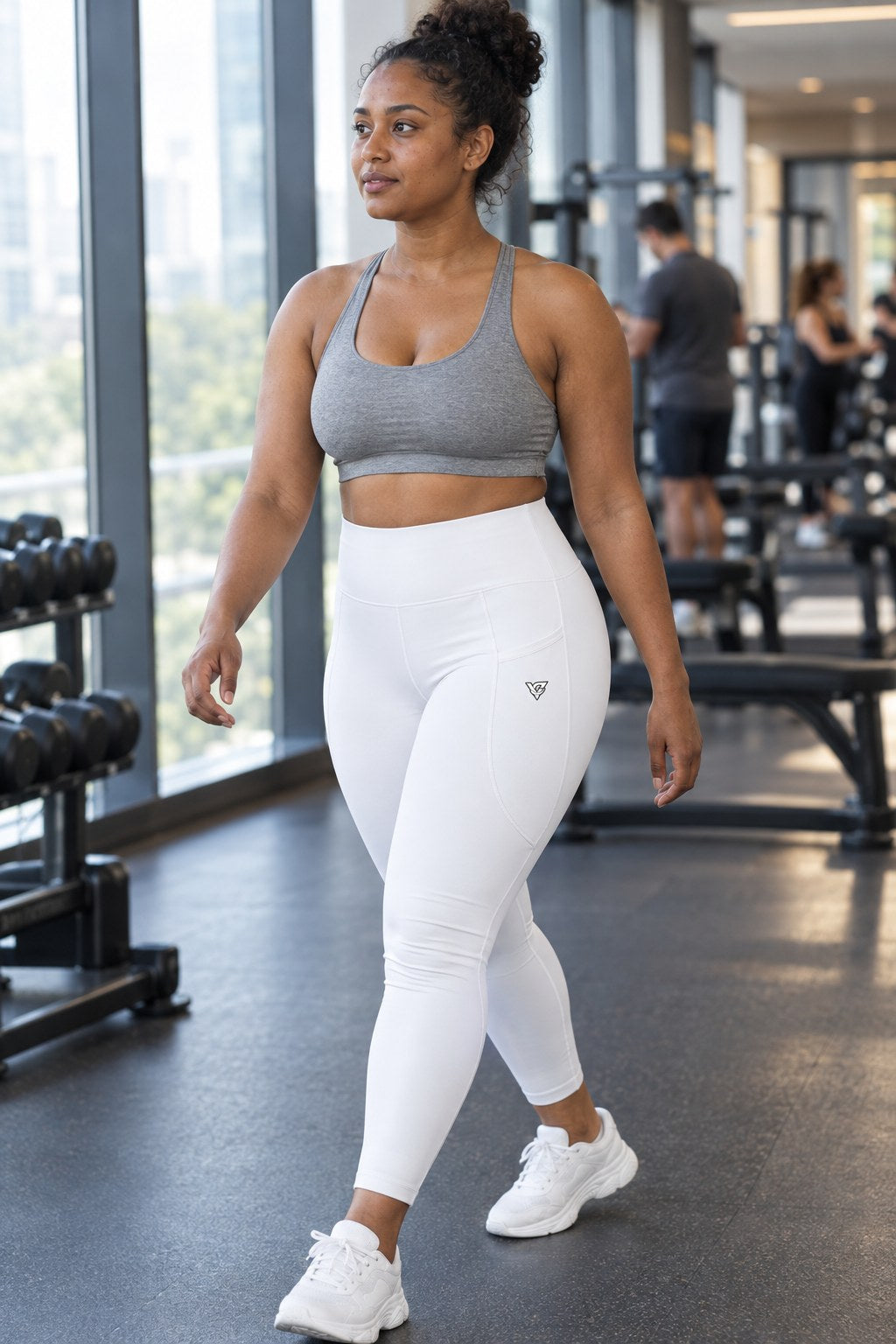 Arctic White Essential leggings with pockets, AI-generated fictional adult model – side view showing the side pocket and V emblem