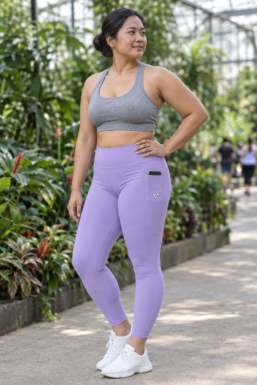 Lavender Essential leggings with pockets, AI-generated fictional adult model – front three-quarter view showing the side pocket