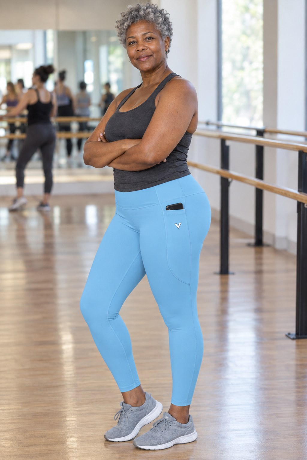Sky Blue Essential leggings with pockets, AI-generated fictional adult model – front three-quarter view showing the side pocket