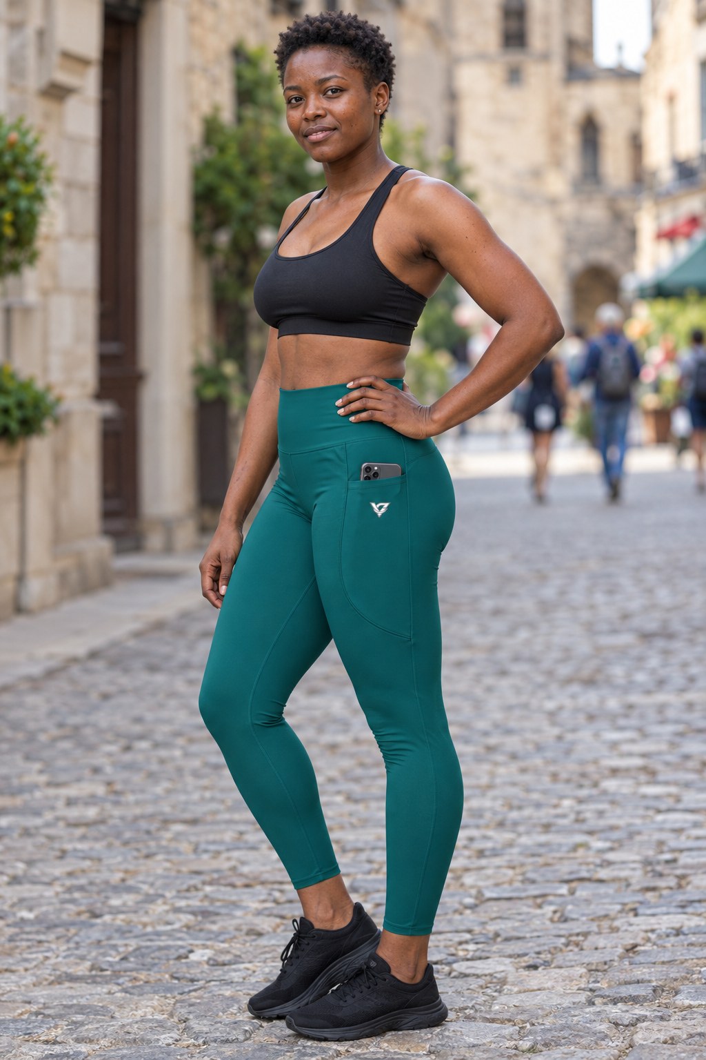 Teal Essential leggings with pockets, AI-generated fictional adult model – front three-quarter view showing the side pocket