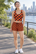 Woman wearing the Bonfire Warp Check women's crop tank and pocket shorts matching set by Vantacore Athletics