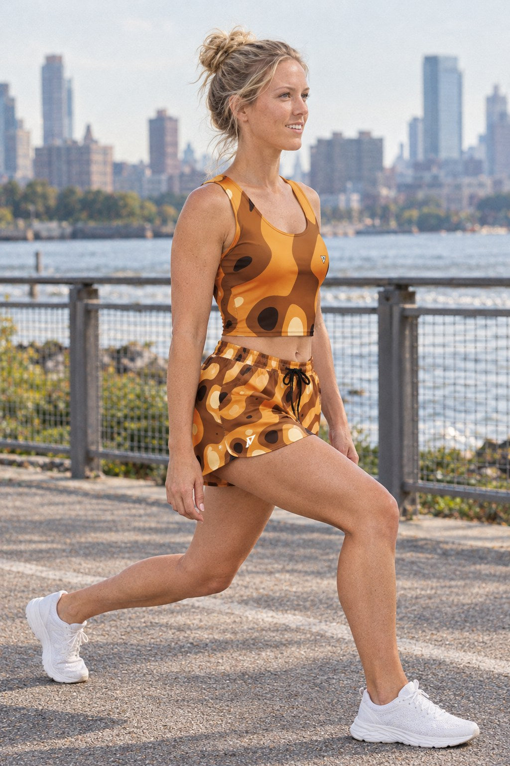 Woman wearing the Cider Ripple women's crop tank and pocket shorts matching set by Vantacore Athletics, side view