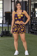 Woman wearing the Halloween Hocus Pocus Jack-O'-Lantern women's crop tank and pocket shorts matching set by Vantacore Athletics