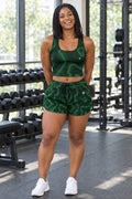 Woman wearing the Jungle Marble women's matching crop tank by Vantacore Athletics, shown with the matching pocket shorts (sold separately)
