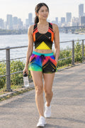 Woman wearing the Neon Gradient women's crop tank and pocket shorts matching set by Vantacore Athletics