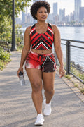 Woman wearing the Red & Black Crimson Streak women's matching crop tank by Vantacore Athletics, shown with the matching pocket shorts (sold separately)
