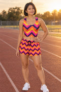 Woman wearing the Sunset Chevron women's matching crop tank by Vantacore Athletics, shown with the matching pocket shorts (sold separately)