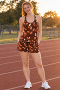 Woman wearing the Terracotta Falling Leaves women's full-length racerback tank and pocket shorts matching set by Vantacore Athletics