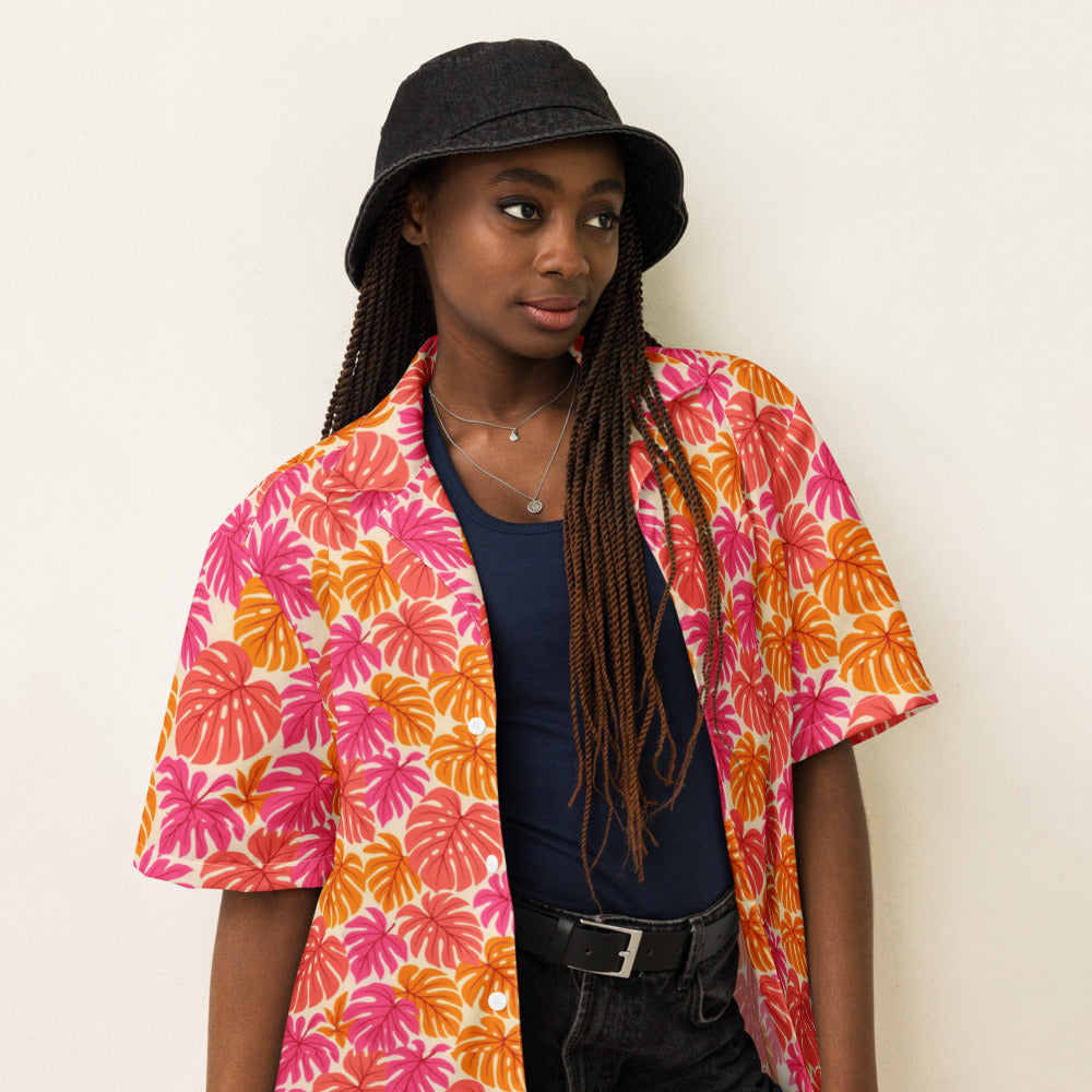 Coral Monstera button-up shirt on a woman, three-quarter view