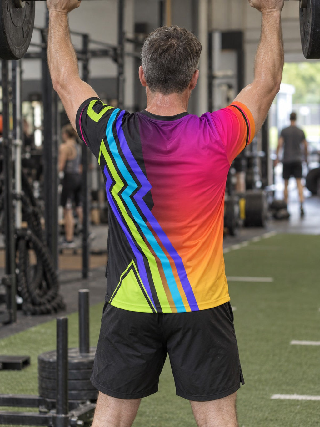 Man training in the Prism Velocity men's sports jersey with the Vantacore V emblem on the left chest – back view