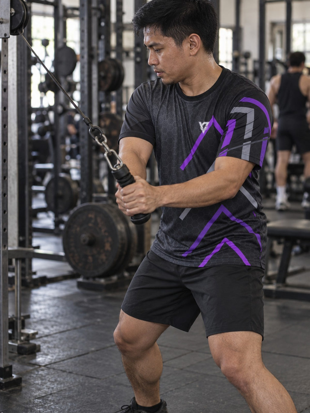 Man training in the Phantom Pulse men's sports jersey with the Vantacore V emblem on the left chest – side view