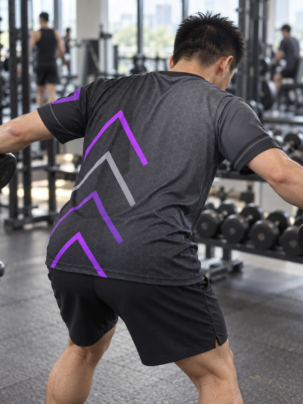 Man training in the Phantom Pulse men's sports jersey with the Vantacore V emblem on the left chest – back view