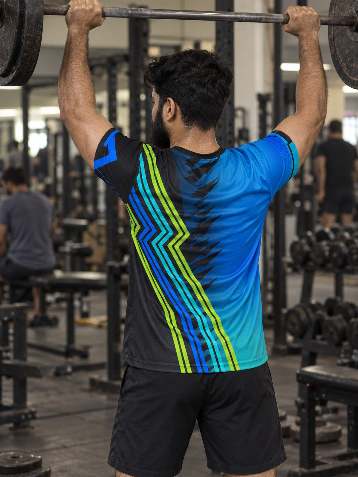 Man training in the Ocean Surge men's sports jersey with the Vantacore V emblem on the left chest – back view