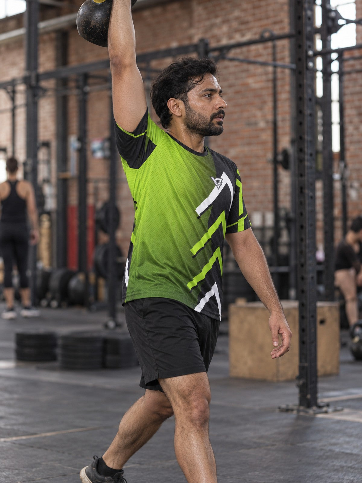 Man training in the Volt Strike men's sports jersey with the Vantacore V emblem on the left chest – side view