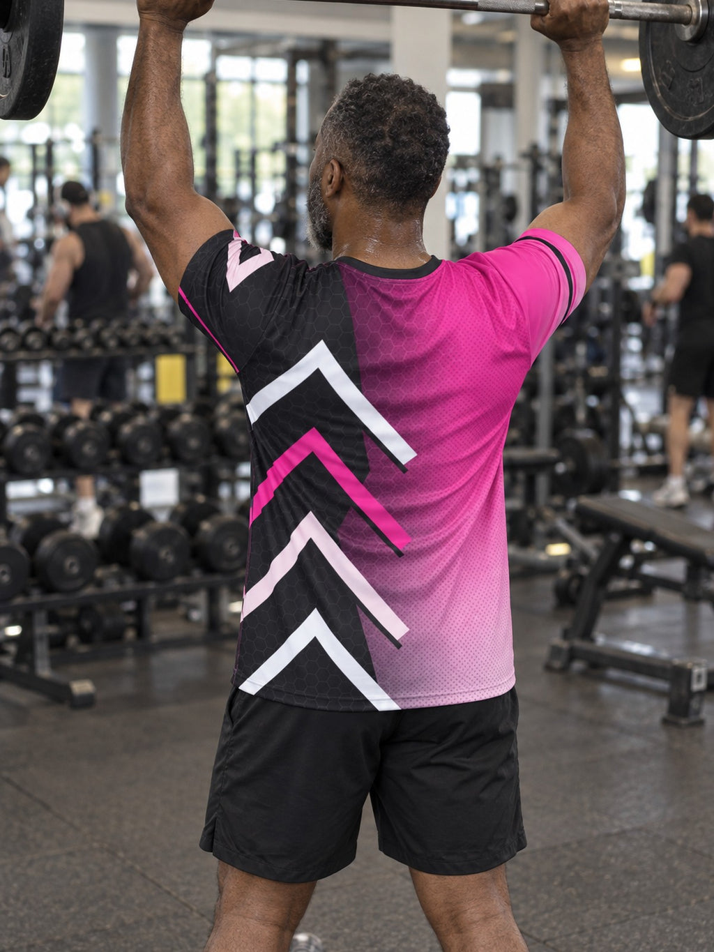 Man training in the Neon Fusion Hex men's sports jersey with the Vantacore V emblem on the left chest – back view