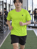 Man training in the Volt Green Essential men's sports jersey with the Vantacore V emblem on the left chest – front view