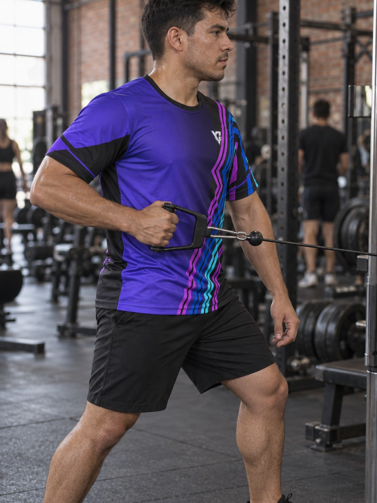 Man training in the Electric Vortex men's sports jersey with the Vantacore V emblem on the left chest – side view
