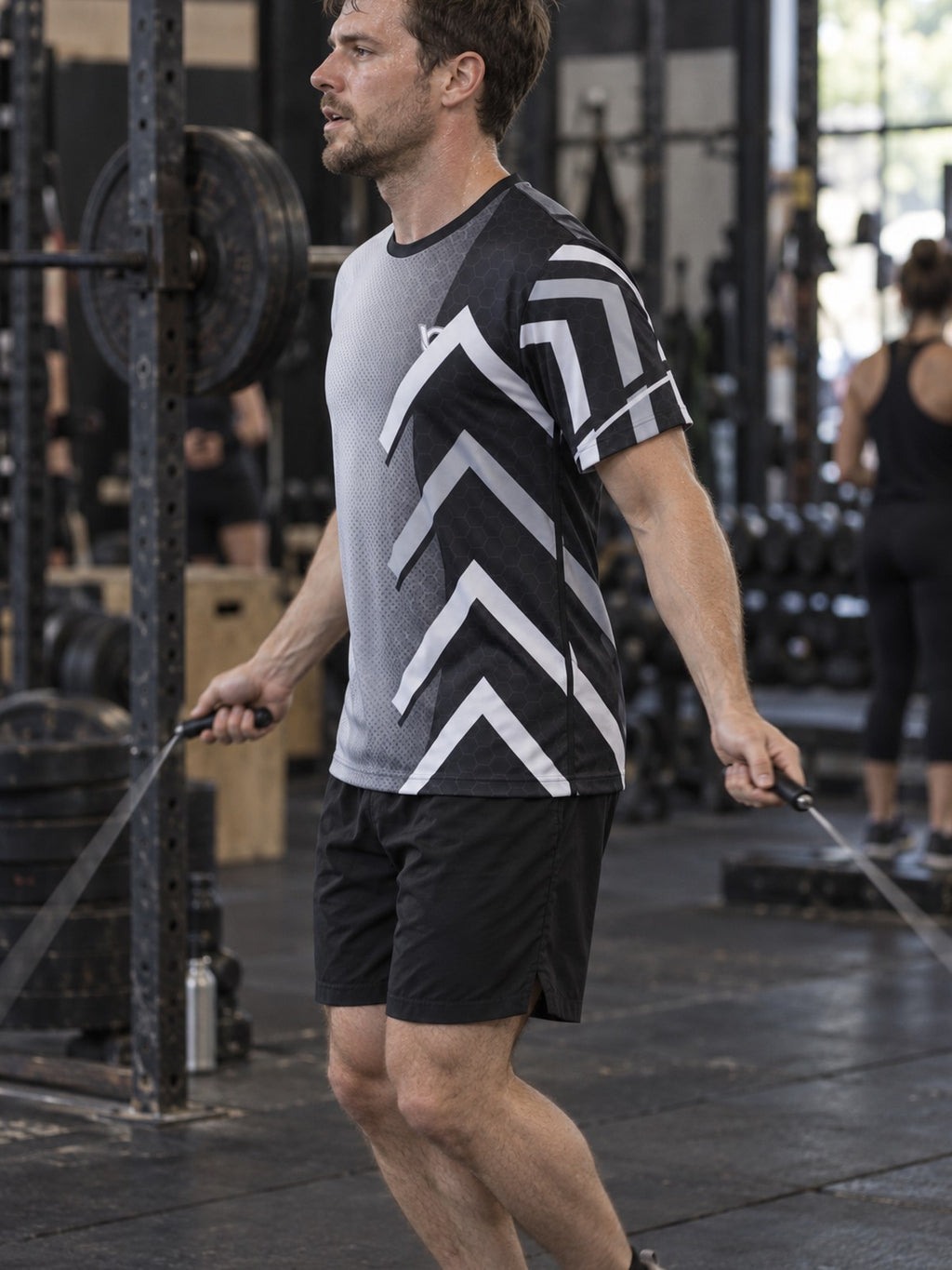 Man training in the Monochrome Apex men's sports jersey with the Vantacore V emblem on the left chest – side view