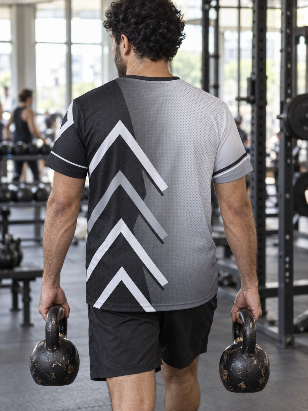 Man training in the Monochrome Apex men's sports jersey with the Vantacore V emblem on the left chest – back view