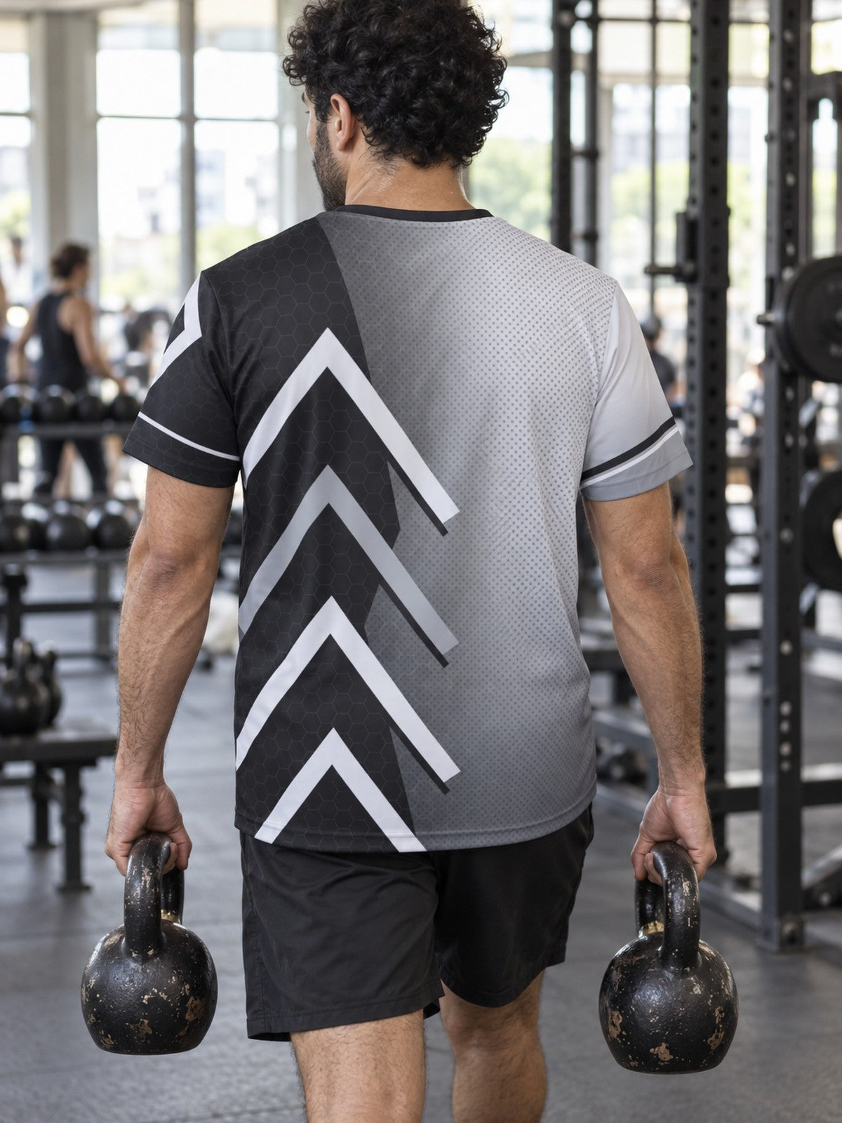 Man training in the Monochrome Apex men's sports jersey with the Vantacore V emblem on the left chest – back view