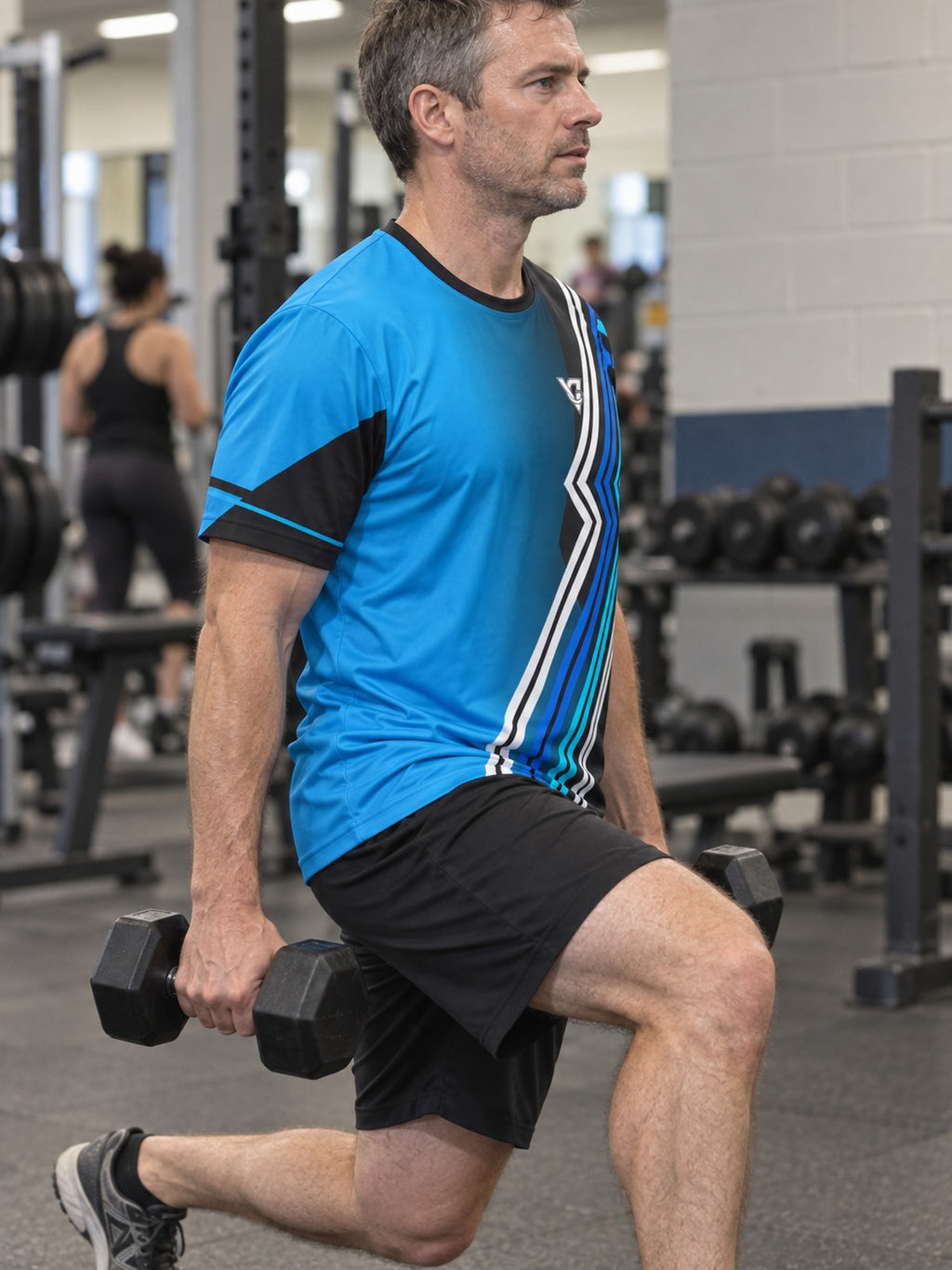 Man training in the Electric Cyan Velocity men's sports jersey with the Vantacore V emblem on the left chest – side view
