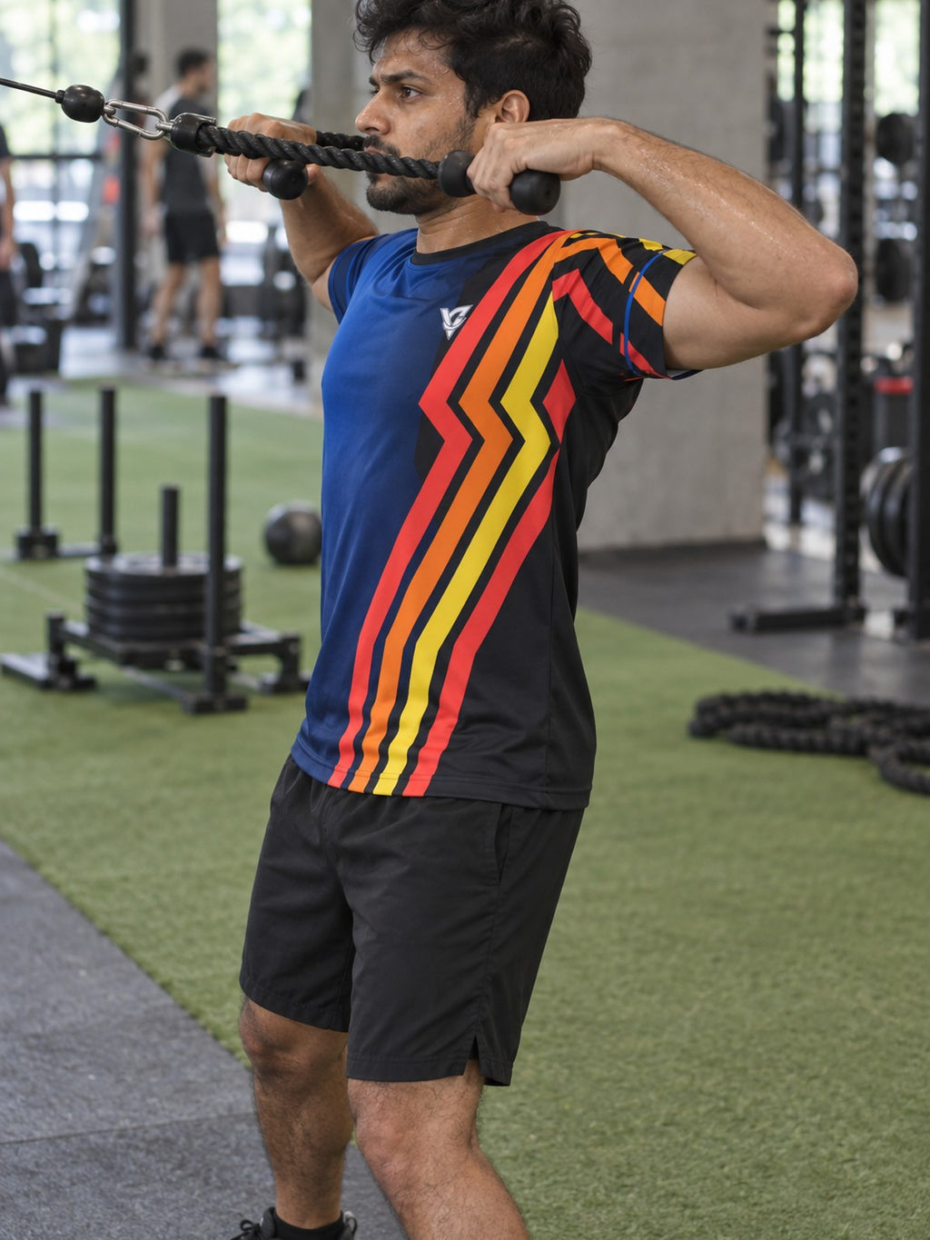 Man training in the Midnight Horizon men's sports jersey with the Vantacore V emblem on the left chest – side view