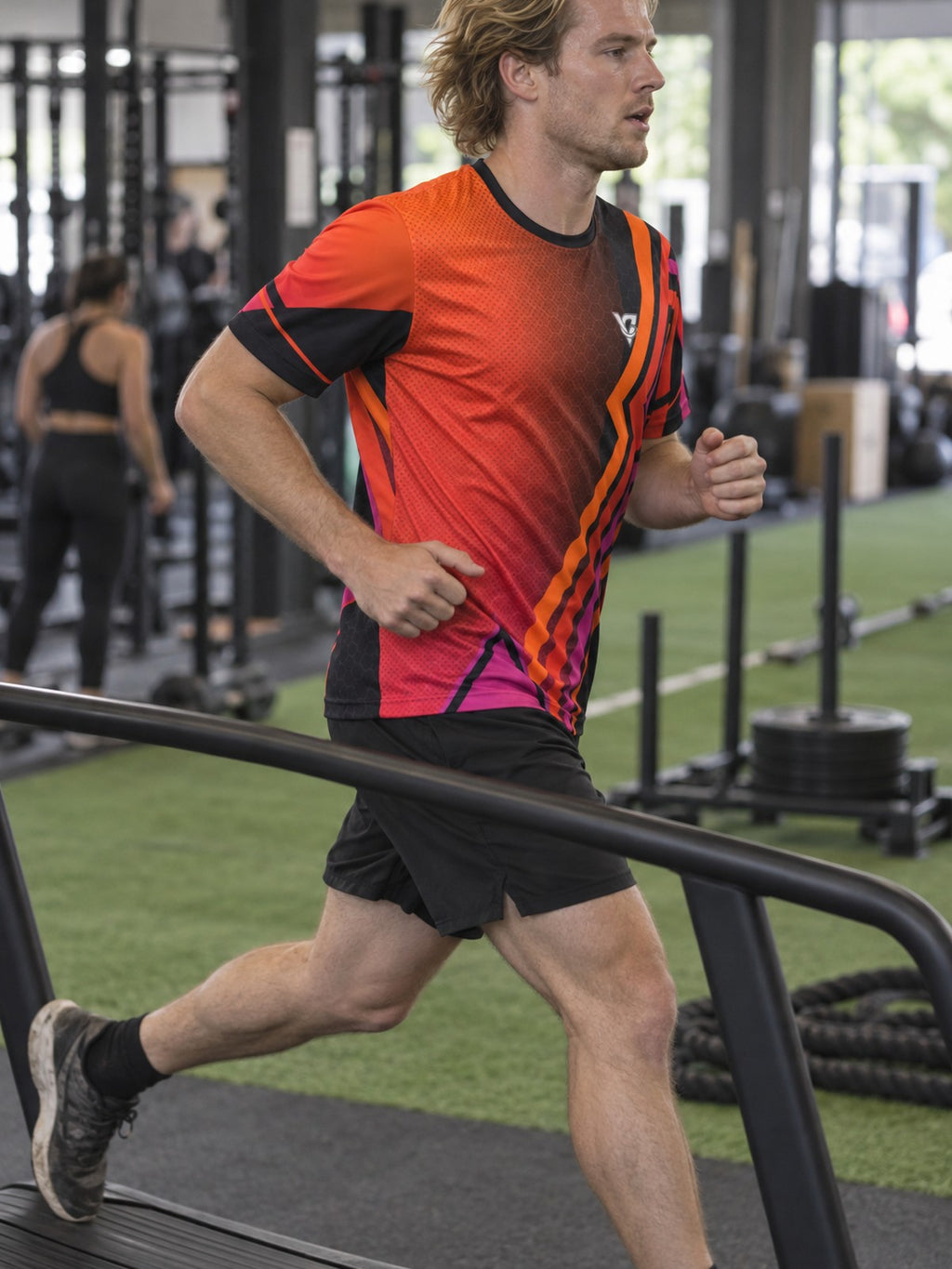 Man training in the Sunset Fusion men's sports jersey with the Vantacore V emblem on the left chest – side view