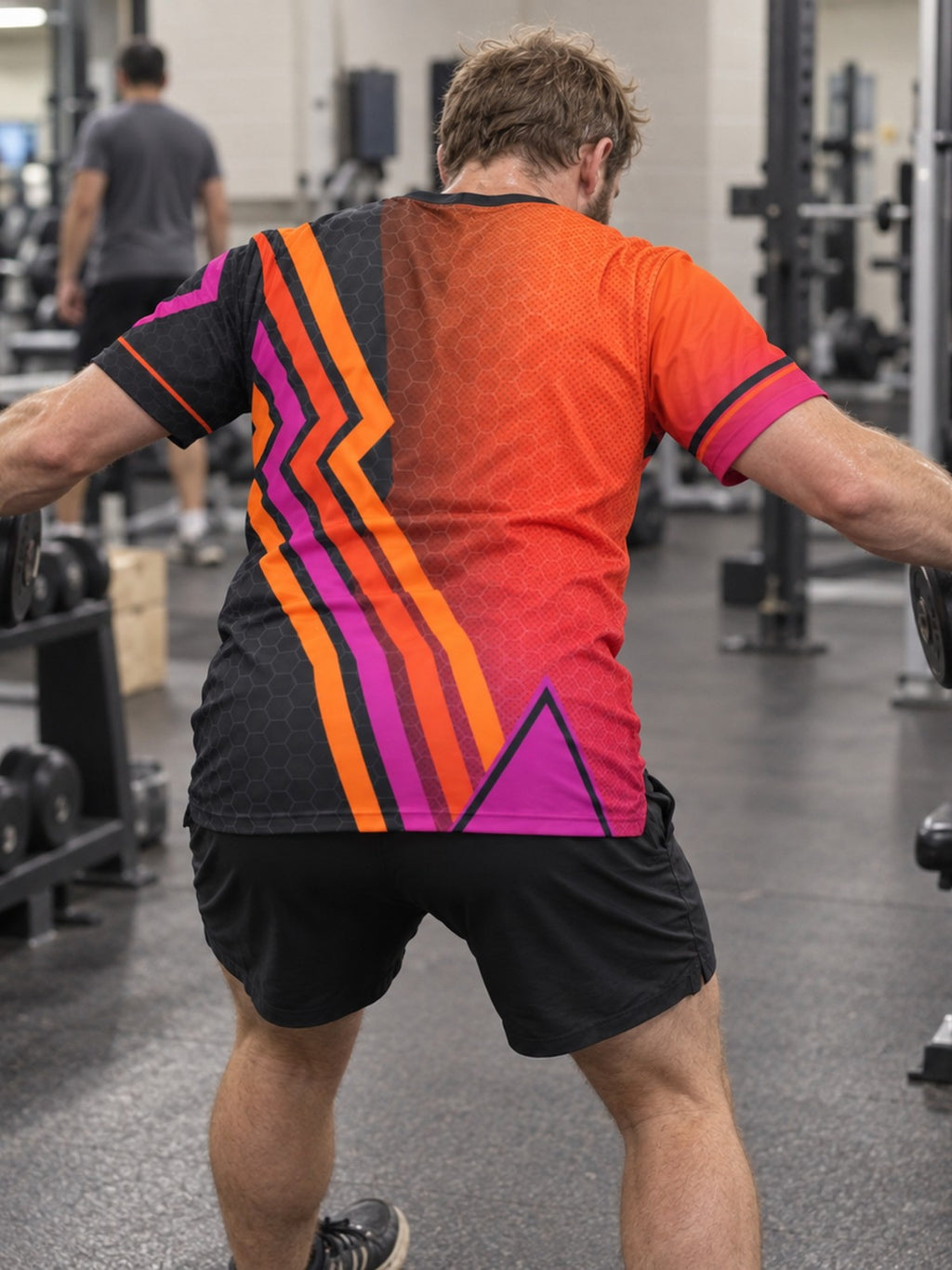 Man training in the Sunset Fusion men's sports jersey with the Vantacore V emblem on the left chest – back view
