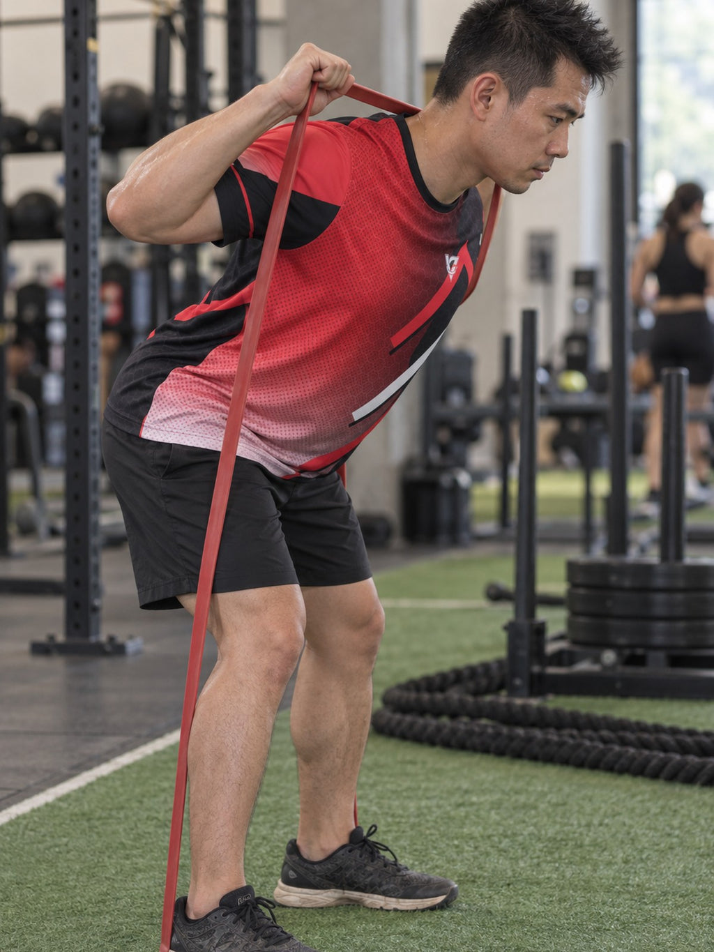 Man training in the Crimson Hex Elite men's sports jersey with the Vantacore V emblem on the left chest – side view