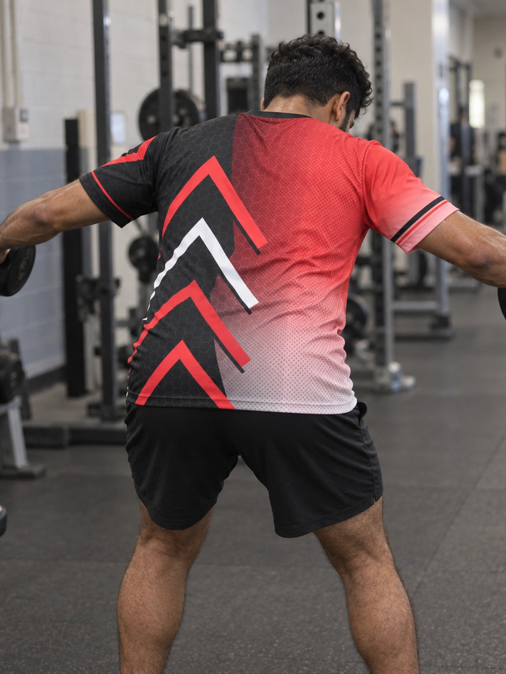Man training in the Crimson Hex Elite men's sports jersey with the Vantacore V emblem on the left chest – back view