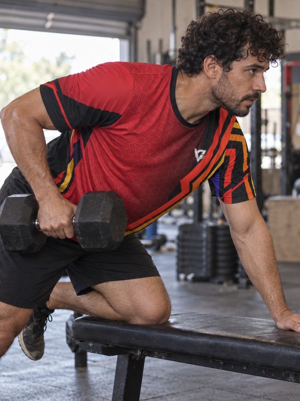 Man training in the Crimson Ember men's sports jersey with the Vantacore V emblem on the left chest – side view