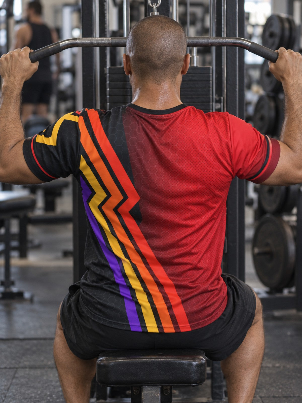 Man training in the Crimson Ember men's sports jersey with the Vantacore V emblem on the left chest – back view