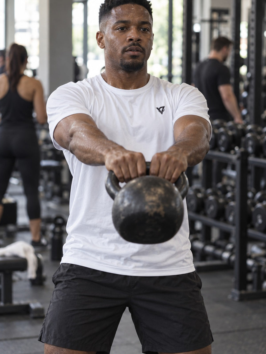 Man training in the Arctic White Essential men's sports jersey with the Vantacore V emblem on the left chest – front view