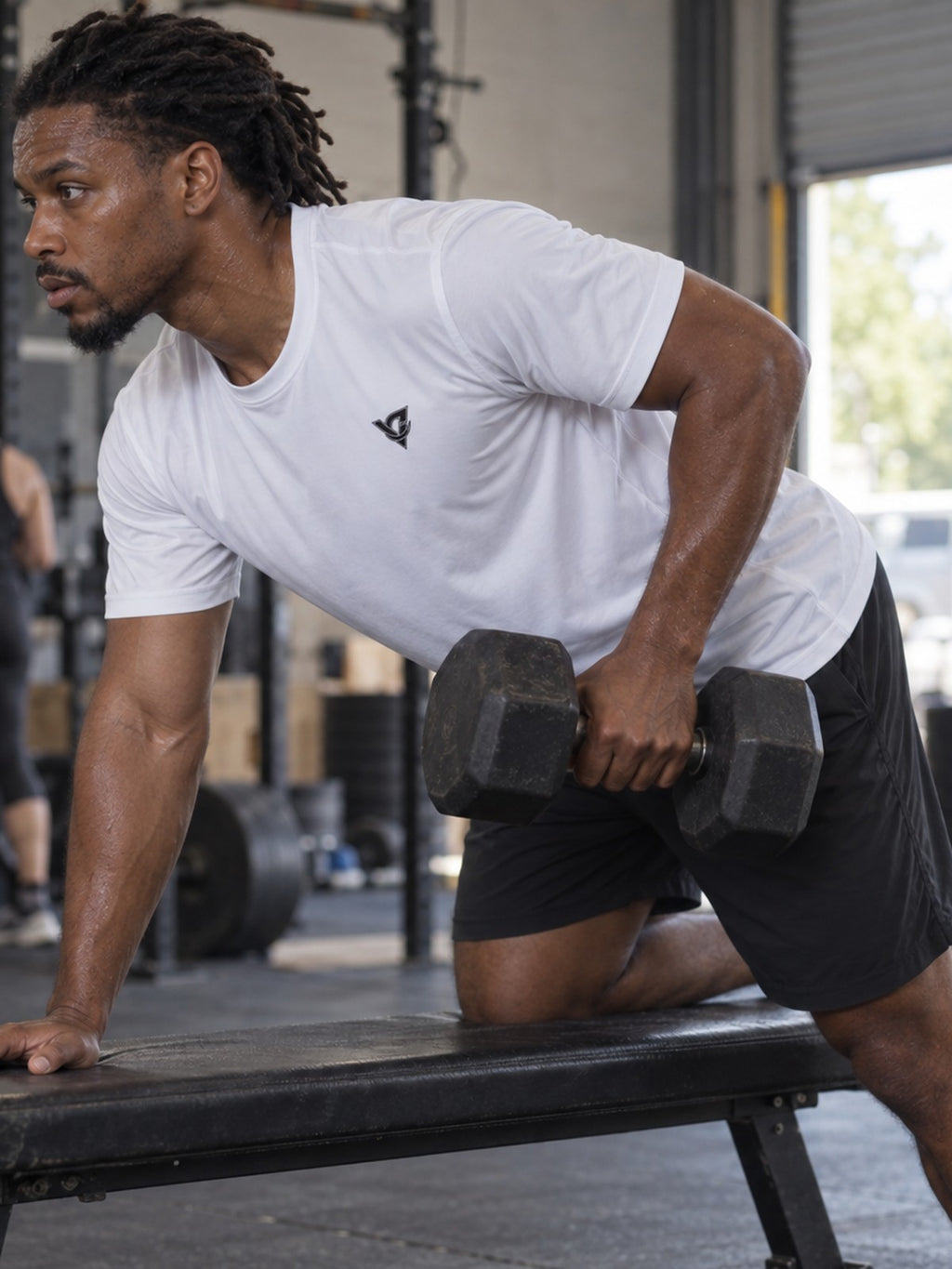 Man training in the Arctic White Essential men's sports jersey with the Vantacore V emblem on the left chest – side view
