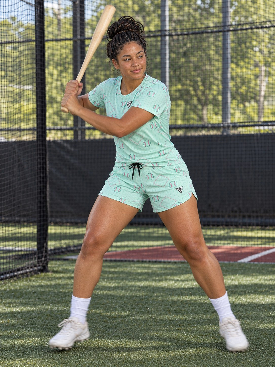 Baseball & Softball Mint Glow Diamond Stitch Women's Athletic Shorts with Pockets, in action
