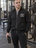 Discipline Over Motivation bomber jacket in black – front
