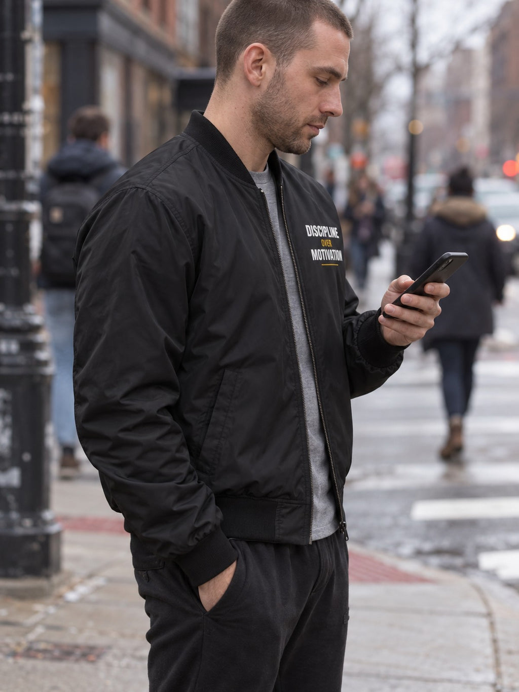 Discipline Over Motivation bomber jacket in black – side view