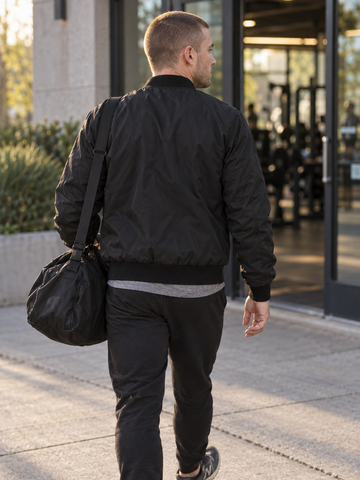 Discipline Over Motivation bomber jacket in black – back view