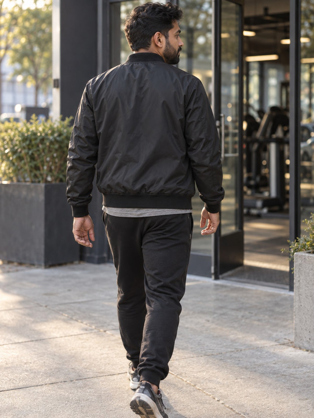 Excuses Don't Burn Calories bomber jacket in black – back view