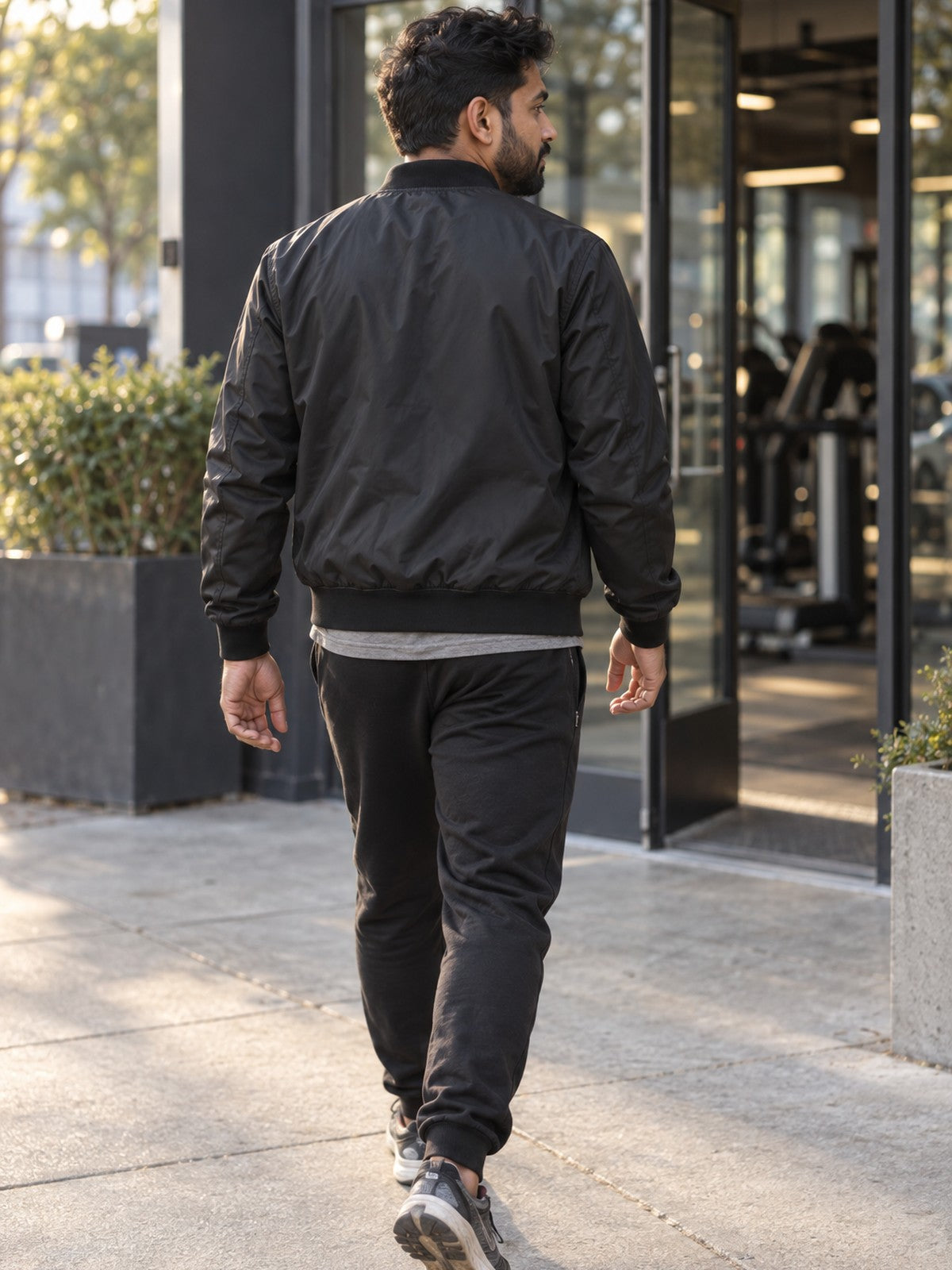 Excuses Don't Burn Calories bomber jacket in black – back view
