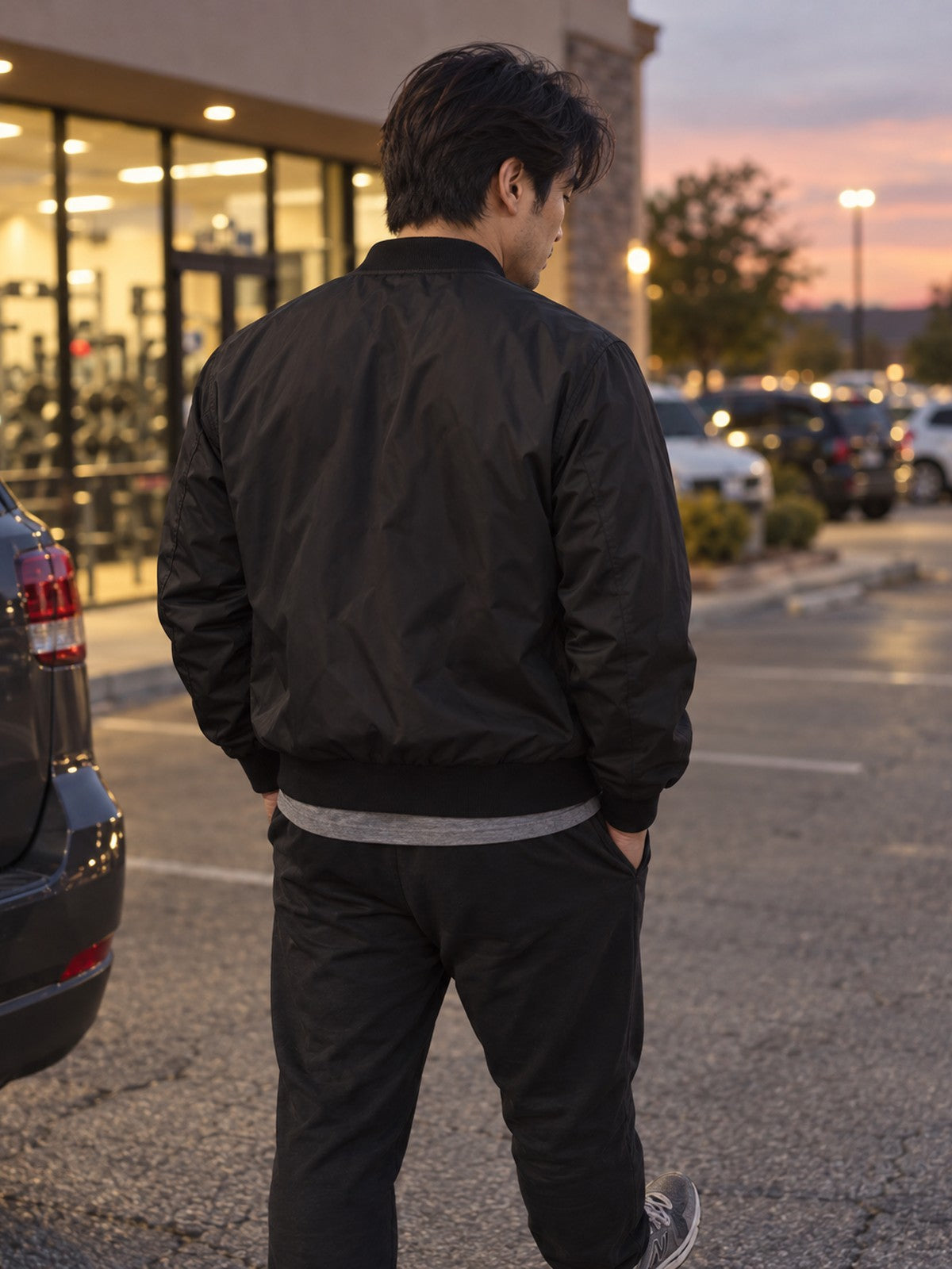 The Grind Never Stops bomber jacket in black – back view