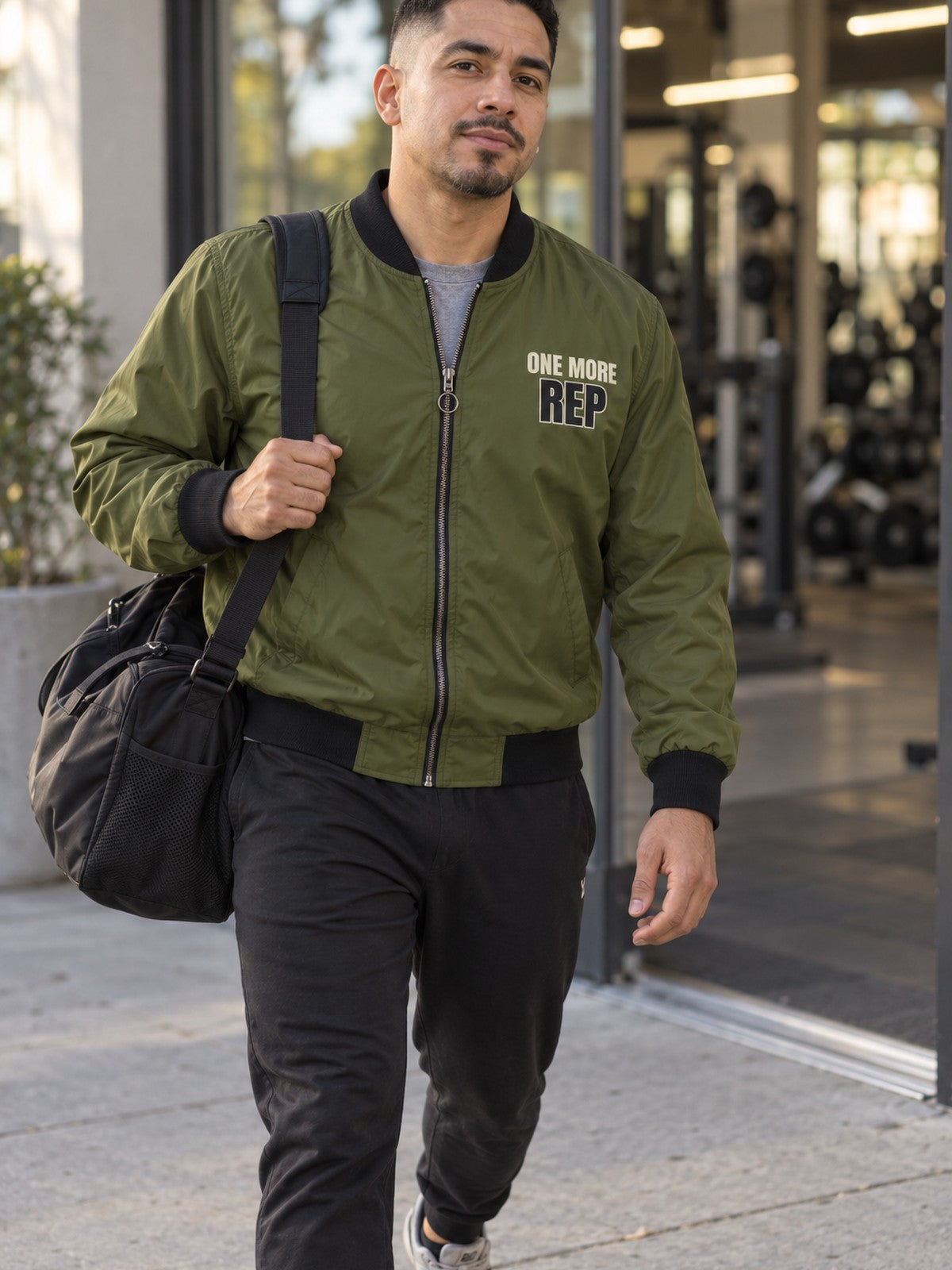 One More Rep bomber jacket in olive – front