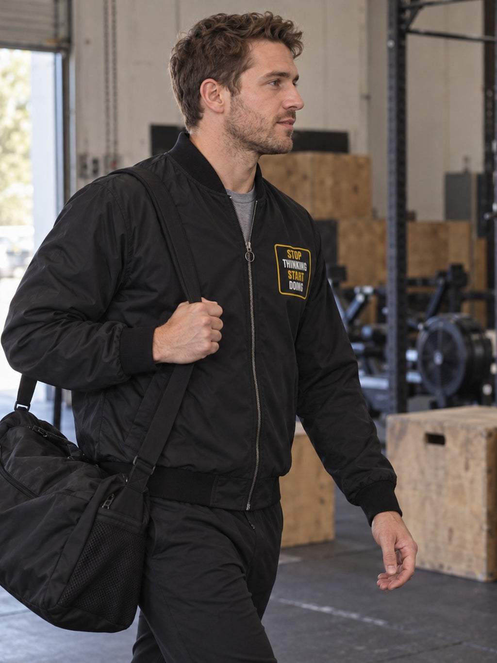 Stop Thinking Start Doing bomber jacket in black – side view