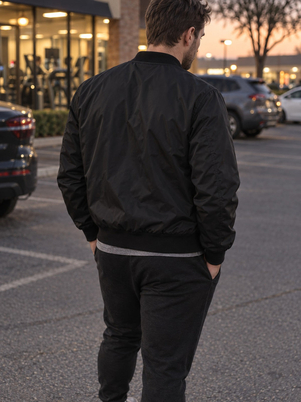 Stop Thinking Start Doing bomber jacket in black – back view