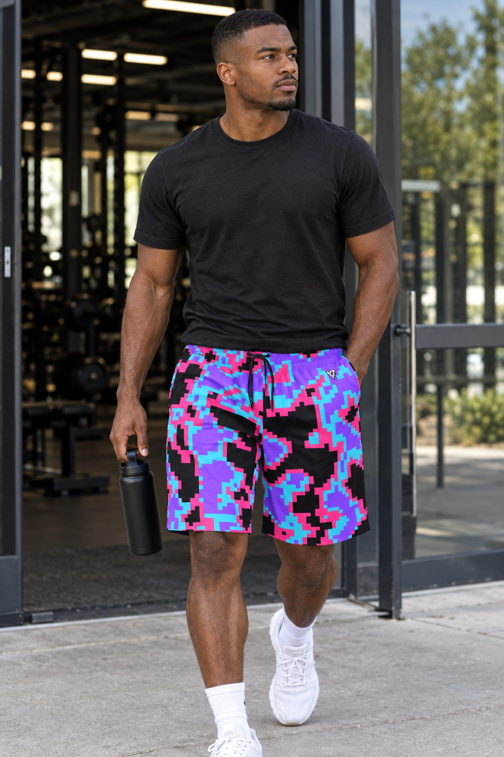 Neon Digital Camo men's athletic jogger shorts worn on a model