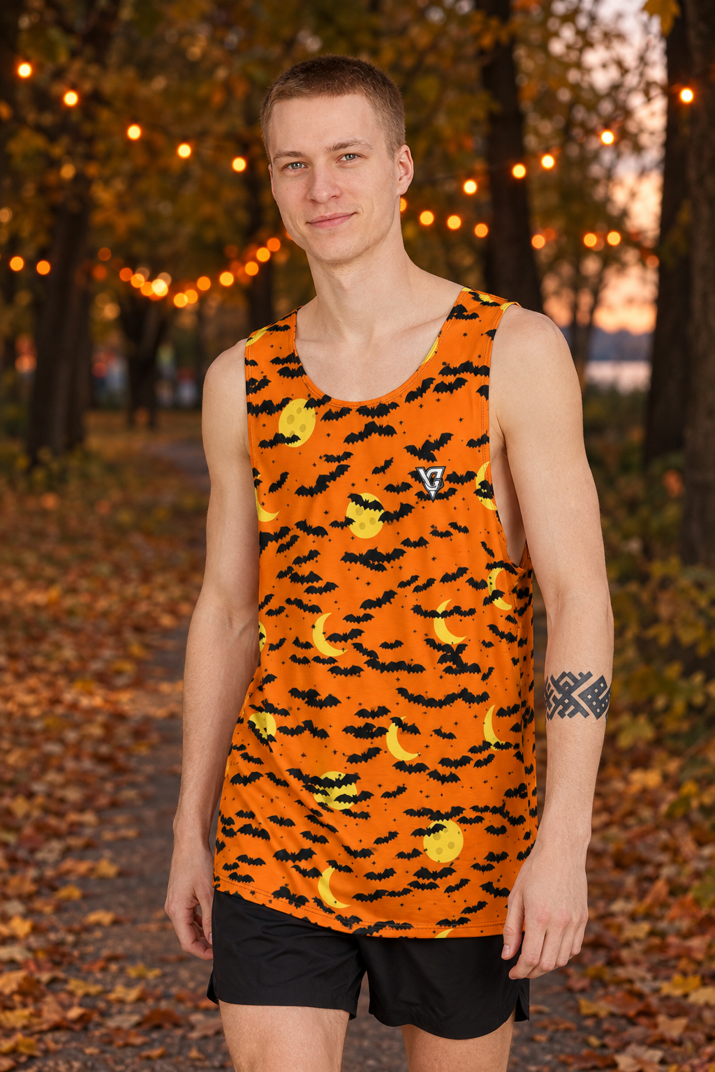 Halloween Pumpkin Orange Bat Swarm men's loose athletic tank top worn on a model