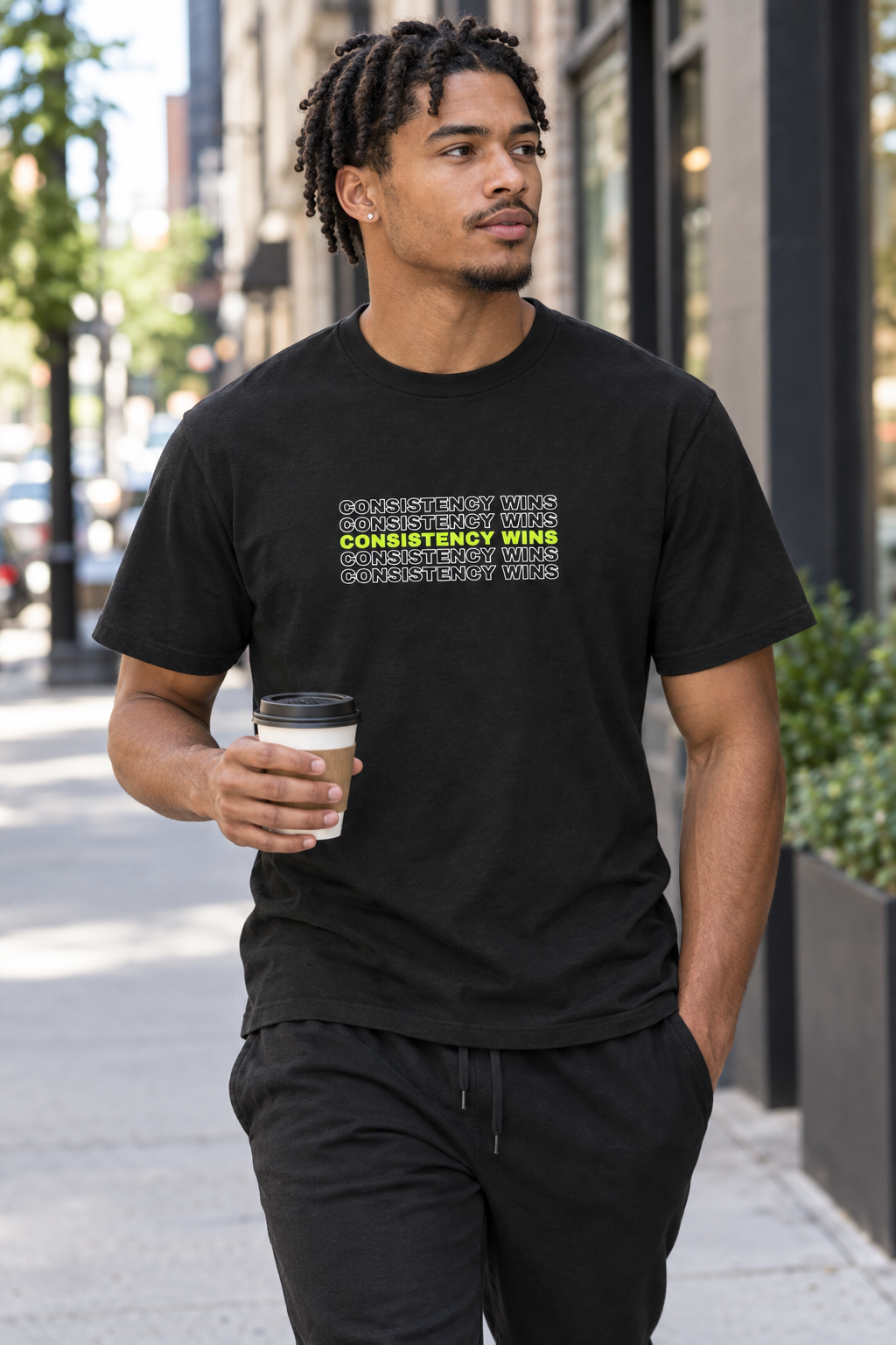 Consistency Wins men's heavy cotton crew-neck t-shirt worn on a model