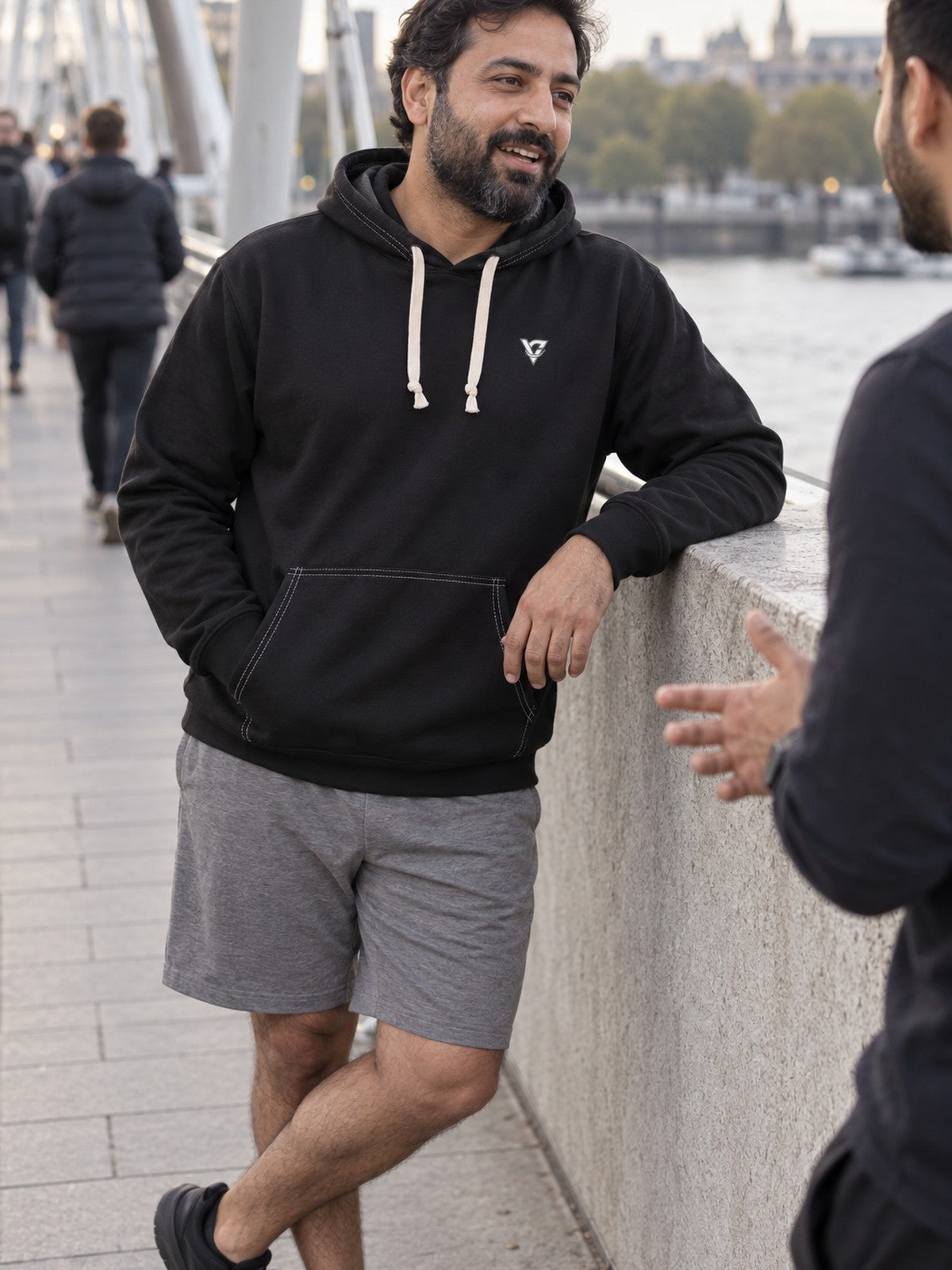 Man wearing the Stealth Black Essential Men's Pullover Hoodie