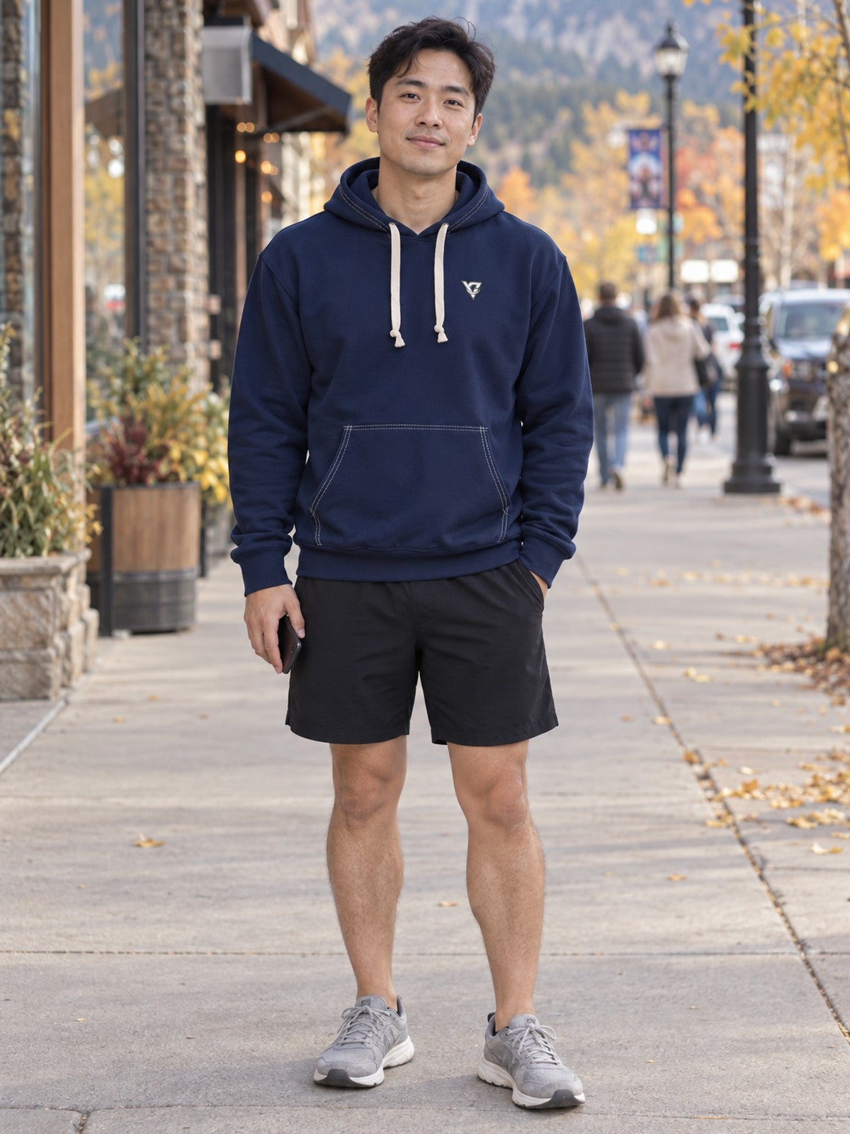 Man wearing the Midnight Navy Essential Men's Pullover Hoodie